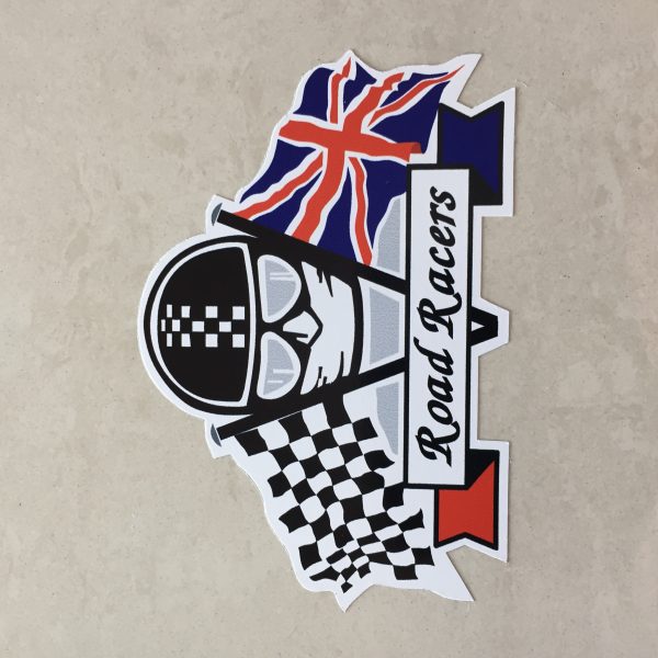 CHEQUERED UNION JACK ROAD RACERS STICKER. Road Racers in black lettering on a white banner. Behind are crossed chequered and Union Jack flags. The face of a motorcyclist wearing helmet, goggles and scarf sits between.