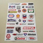 SCALEXTRIC, SLOT CAR STICKER SET. An assortment of stickers. Logos including Texaco, Castrol, Bell Helmets, Esso, Shell, Dunlop, Route 66 and more.