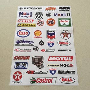 SCALEXTRIC STICKER SET. An assortment of stickers. Logos including Texaco, Castrol, Bell Helmets, Esso, Shell, Dunlop, Route 66 and more.