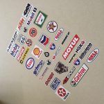 SCALEXTRIC, SLOT CAR STICKER SET. An assortment of stickers. Logos including Texaco, Castrol, Bell Helmets, Esso, Shell, Dunlop, Route 66 and more.