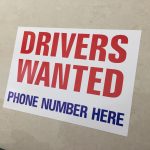 Drivers Wanted in red uppercase lettering Phone Number Here in blue uppercase lettering on a white background.