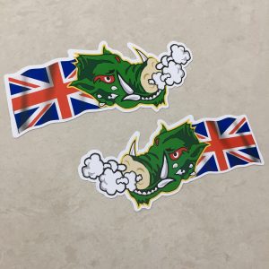 UNION JACK WARTHOG STICKERS. A green headed warthog with red eyes and white horns. Air is expelling from the nostrils. A Union Jack flag is flowing behind.