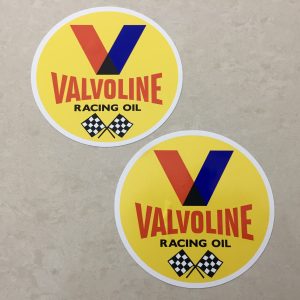VALVOLINE RACING OIL STICKERS. Valvoline in red and Racing Oil in black uppercase lettering. Above is the letter V in red and blue. Below are two crossed chequered flags on a yellow circular sticker.Valvoline in red and Racing Oil in black uppercase lettering. Above is the letter V in red and blue. Below are two crossed chequered flags on a yellow circular sticker.