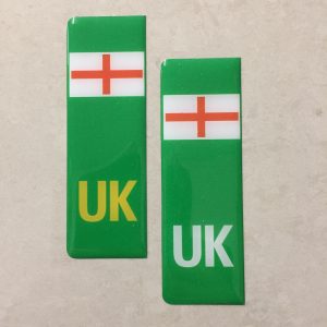 NUMBER PLATE ORIGIN EV STICKERS DOMED RESIN GEL ENGLAND. Two green columns. UK in white at the base of one column. UK in yellow on the other. Both stickers have the England flag at the top.