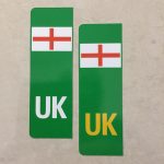 NUMBER PLATE ORIGIN EV STICKERS ENGLAND. Two green columns. UK in white at the base of one column. UK in yellow on the other. Both stickers have the England flag at the top.