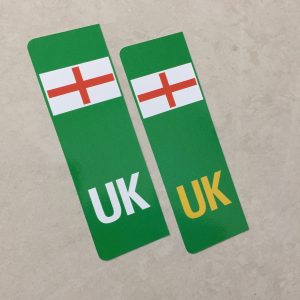 Two green columns. UK in white at the base of one column. UK in yellow on the other. Both stickers have the England flag at the top.