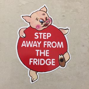 AWAY FROM FRIDGE STICKER. A humorous piggy. Step Away From The Fridge in white lettering on it's round red body.