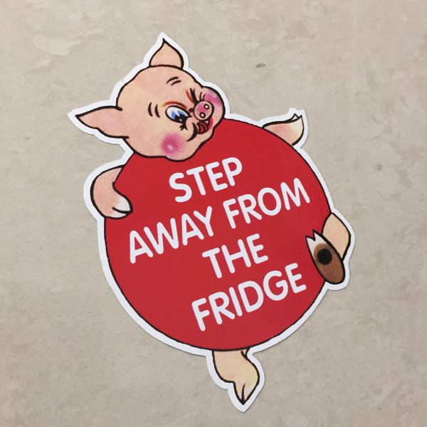 A humorous piggy. Step Away From The Fridge in white lettering on it's round red body.