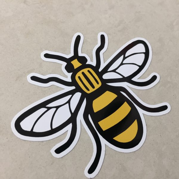 MANCHESTER BEE STICKER. A black and yellow striped bee displaying antennae and wings.