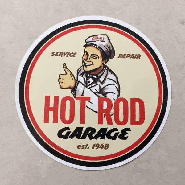 A circular sticker with a black and red border. Hot Rod in red and Garage in black uppercase lettering. A man wearing a grey cap and jacket is winking and giving the thumbs up. Additional lettering Service, Repair, Est. 1948.