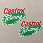 CASTROL RACING OUTLINED STICKERS. A white sticker with a green brush stroke in the centre. Castrol in red and Racing in white lettering overlays this.