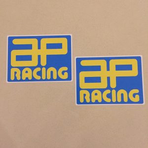 AP RACING STICKERS. AP Racing in bold yellow uppercase lettering on a blue rectangular sticker.