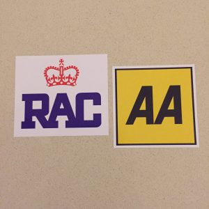 AA AND RAC STICKERS. AA in black lettering on a yellow square. RAC in blue lettering with a red crown above on a white sticker.