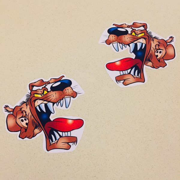 ANGRY DOG STICKERS. A cartoon character of an angry dog with a brown coat, a big nose, floppy ears and yellow eyes. The jaws are wide open displaying sharp white teeth and a red tongue.