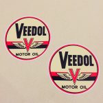 VEEDOL MOTOR OIL STICKERS. Veedol Motor Oil in black lettering on a circular sticker. The letter V in red overlays a pair of wings and two horizontal bands in red and black.