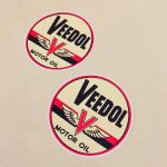 VEEDOL MOTOR OIL STICKERS. Veedol Motor Oil in black lettering on a circular sticker. The letter V in red overlays a pair of wings and two horizontal bands in red and black.