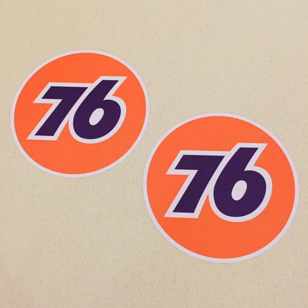 76 UNION RACE CAR STICKERS The number 76 in blue in the centre of an orange circular sticker.