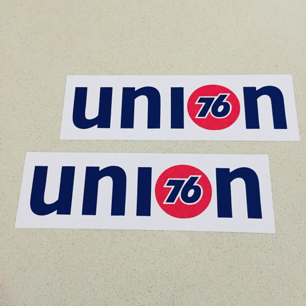 UNION 76 STICKERS. Union 76 on a white rectangular sticker. The letters u, n and i are blue and lowercase. The letter o is replaced with the 76 logo - the number 76 in blue in the centre of a red orange ball.