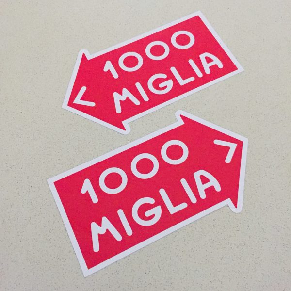 MILLE MIGLIA 1000 STICKERS. 1000 Miglia in white lettering on a red direction of travel arrow with a white border.