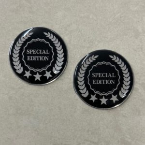 SPECIAL EDITION DOMED RESIN GEL STICKERS. Special Edition in uppercase silver lettering in the centre. Silver stars and laurel leaves surround this domed resin gel circular sticker.