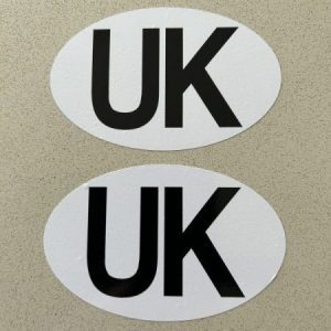 UK STICKERS FOR MOTORBIKES - COUNTRY OF ORIGIN. UK in black lettering on a white oval sticker.
