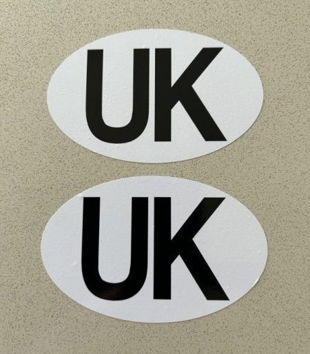 UK STICKERS FOR MOTORBIKES - COUNTRY OF ORIGIN. UK in black lettering on a white oval sticker.