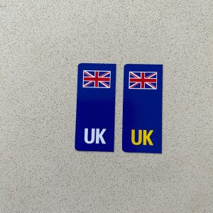 UK NUMBER PLATE STICKERS FOR MOTORBIKES. Two blue columns. UK in white at the base of one column and UK in yellow on the other. A horizontal Union Jack sits at the top of each column.