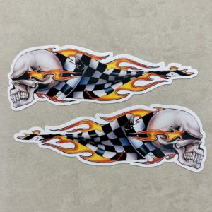 SKULL AND CHEQUERED FLAMES STICKERS. A skull trailing flames and a black and white chequered flag behind.