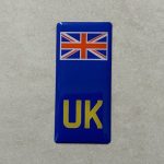 UK NUMBER PLATE DOMED RESIN GEL STICKER FOR MOTORBIKES. A blue domed resin gel column. UK in yellow at the base with a Union Jack at the top.