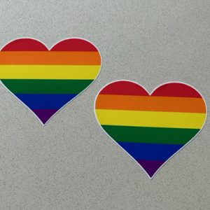 LGBTQ+ HEART STICKERS. A heart made up of six horizontal stripes of colour. Red, orange, yellow, green, blue and violet.