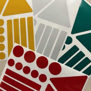 REFLECTIVE / FLUORESCENT SAFETY STICKERS. 15 various reflective or fluorescent shapes: circles, triangles and rectangles.
